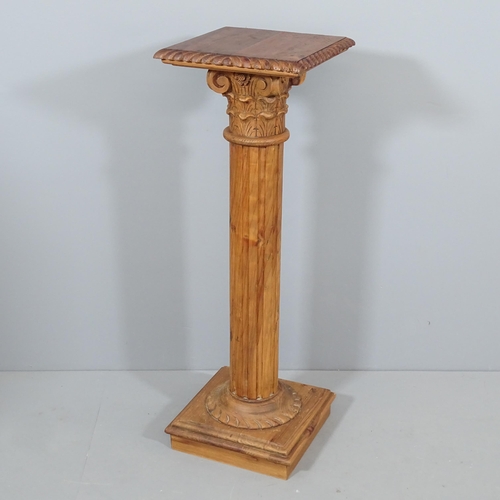 2255 - A pine Corinthian column pedestal with carved fluted and rope twist decoration.  35x105cm.