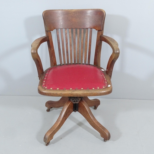 2261 - An early 20th century oak Captain's swivel desk chair.