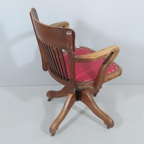 2261 - An early 20th century oak Captain's swivel desk chair.