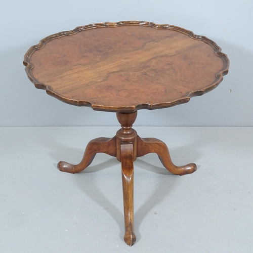 2262 - An antique mahogany and walnut tilt-top occasional table, with pie-crust edge and tripod base. 62x50... 