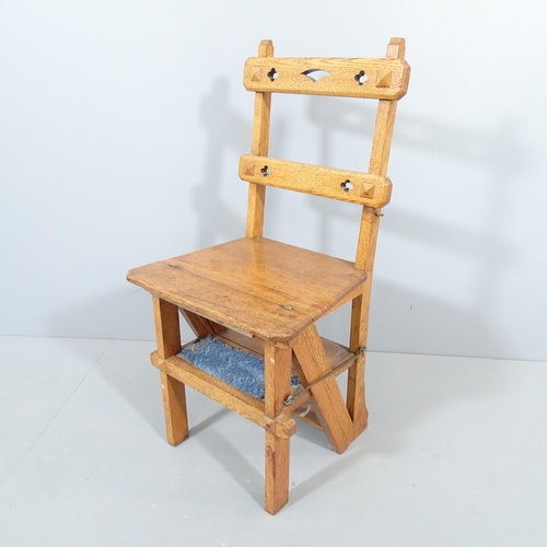 2272 - An Arts & Crafts oak metamorphic library step chair, with cut-out decoration. Overall 44x90x43cm (as... 