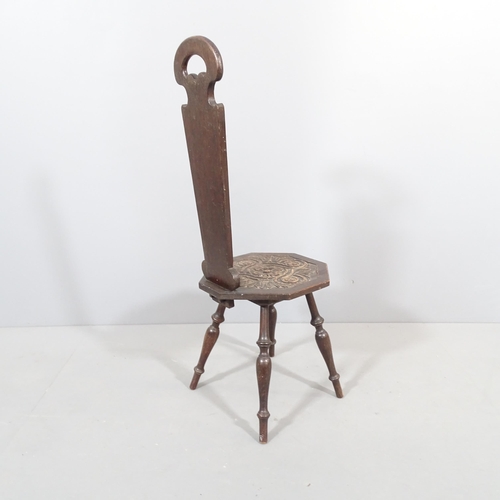 2274 - An antique oak spinning stool, with carved seat and removable back panel.