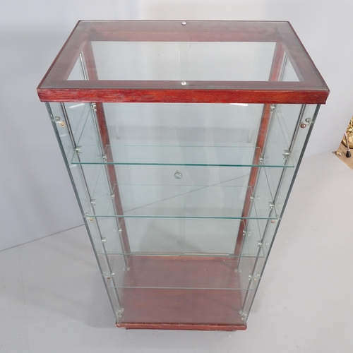 2276 - An oak and glass shop display case with four shelves and rear sliding doors. 62x138x40cm. Shelf 57x3... 