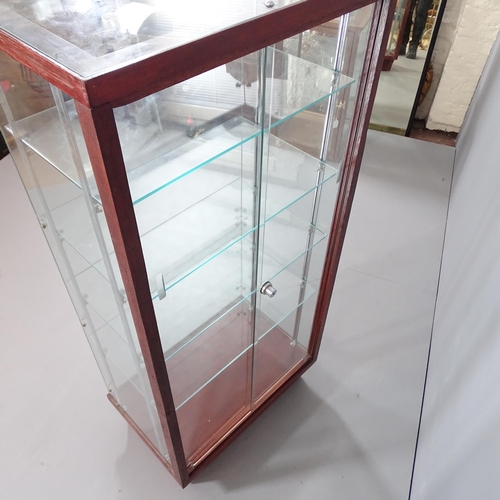 2276 - An oak and glass shop display case with four shelves and rear sliding doors. 62x138x40cm. Shelf 57x3... 