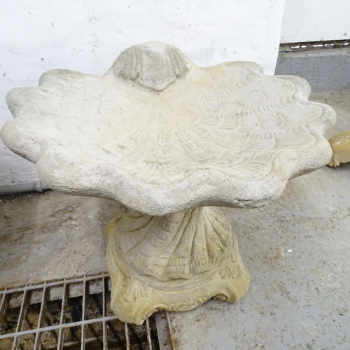 2567 - A modern concrete two-section shell design bird bath. 51x44cm