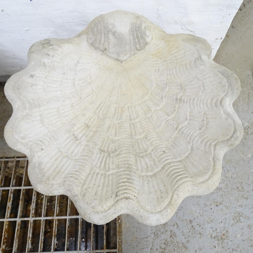 2567 - A modern concrete two-section shell design bird bath. 51x44cm