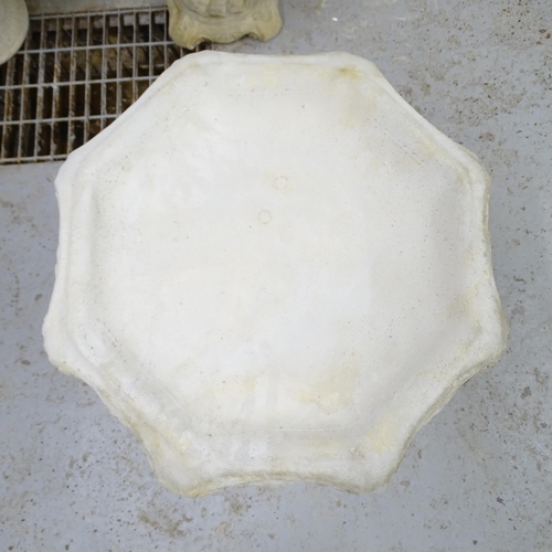 2568 - A modern concrete two-section bird bath with scrolled decoration. 52x66cm.