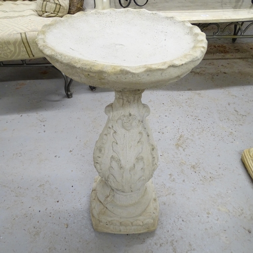 2570 - A modern concrete two-section bird bath with oak leaf decoration. 35x60cm.