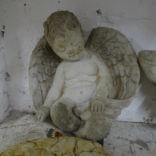 2576 - A concrete cherub wall mask, 38x27cm, two wall pockets and a cherub ornament (4).