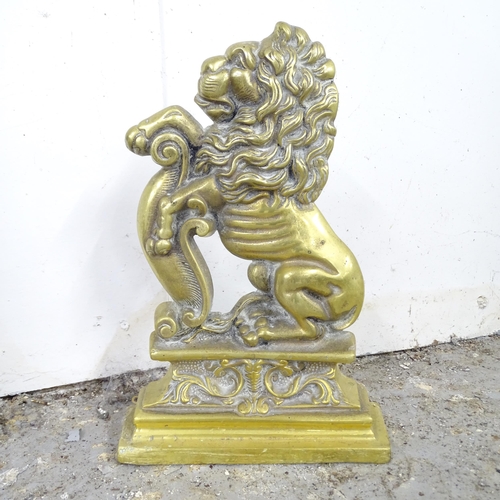 2593 - A brass lion door stop. 23x33cm.