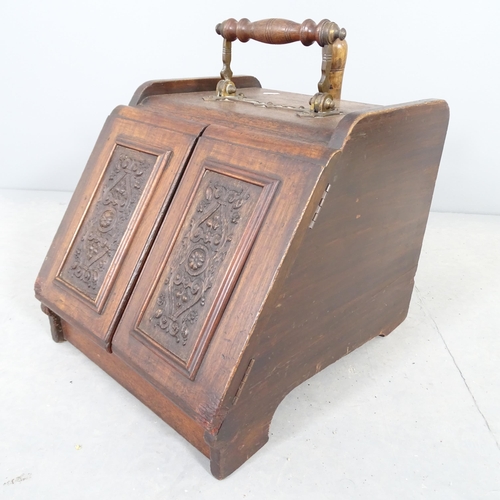 2596 - A Victorian mahogany coal scuttle, with opening mechanism to two doors, applied carved panels, liner... 