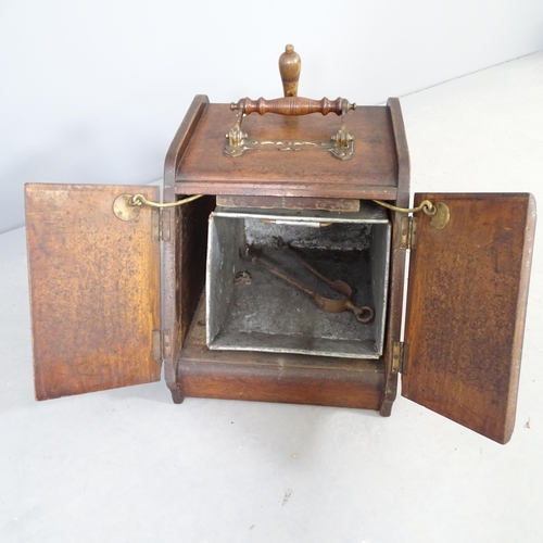 2596 - A Victorian mahogany coal scuttle, with opening mechanism to two doors, applied carved panels, liner... 