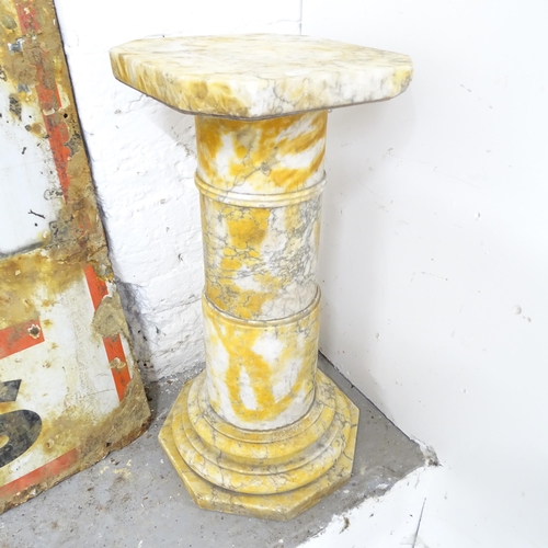 2600 - A five-section marble pedestal. 28x60cm. Top A/F.