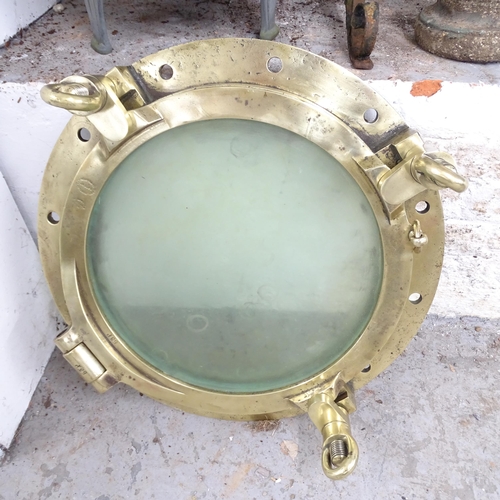 2605 - A polished bronze porthole, impressed W L Halley of Dumbarton. Diameter 59cm.