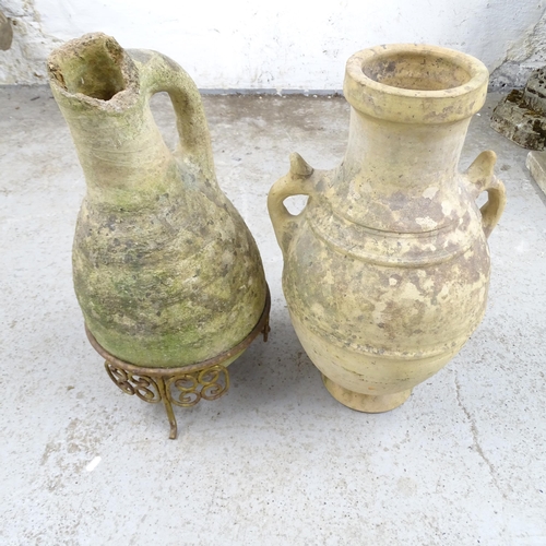 2609 - Two similar terracotta oil jars, one on stand (A/F). Tallest 60cm.