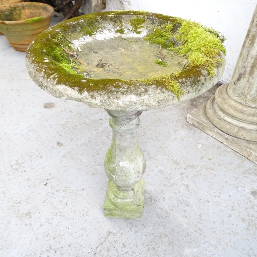 2616 - A two-section weathered concrete bird bath on stand. 39x60cm.