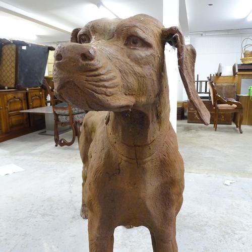 2619 - A large and impressive cast iron garden statue, study of a dog. 135x98x40cm.