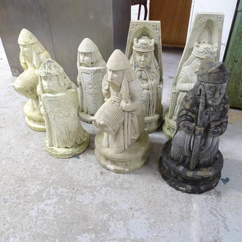 2620 - Seven various garden statues in the form of Lewis chess pieces. Tallest 66cm.