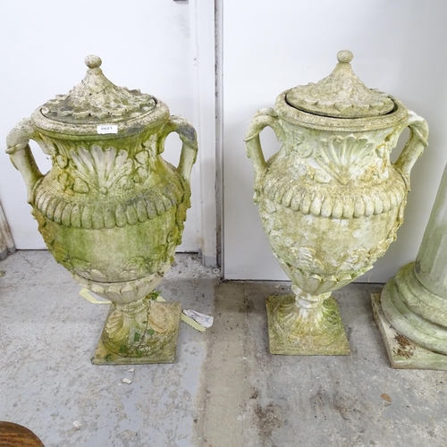 2621 - A pair of weathered concrete three-section garden urns. Height 85cm.