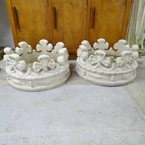 2627 - A pair of concrete gate post caps in the form of crowns. 53x28cm.