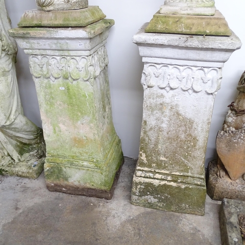 2629 - A pair of of weathered concrete garden pedestals. 40x94cm.