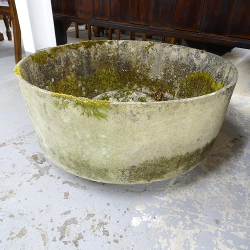 2636 - A weathered composition circular planter. 79x38cm.