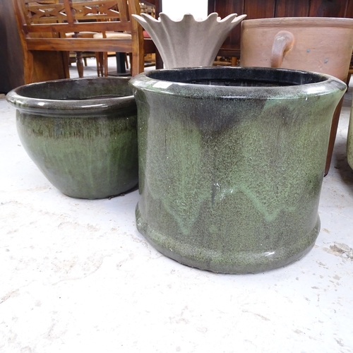 2637 - Two similar green-glazed terracotta garden planters, largest 50x40cm, a terracotta urn, 52x38cm, and... 