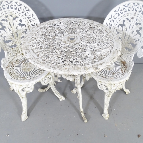 2639 - A painted metal circular garden table, 68x68cm, with four matching chairs.