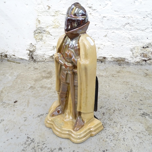 2646 - A painted metal fire companion set in the form of a knight. Height 38cm. Missing one tool.