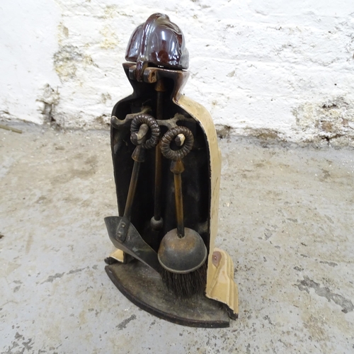 2646 - A painted metal fire companion set in the form of a knight. Height 38cm. Missing one tool.