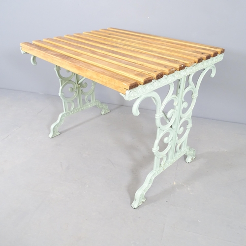 2651 - A teak slatted garden table on painted metal base. 88cm x 68cm x 68cm.