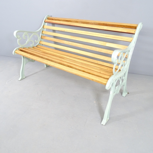 2652 - A teak slatted garden bench with painted metal ends. 137x76x72cm.