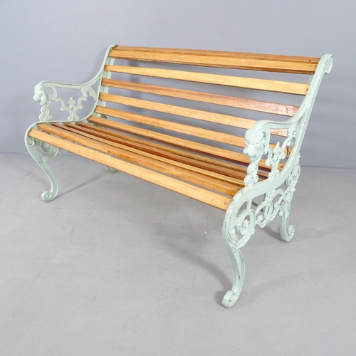 2653 - A teak slatted garden bench with painted metal ends. 127x77x70cm.