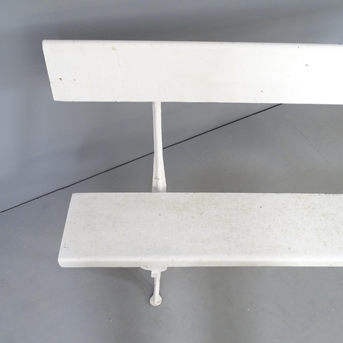 2657 - A white painted garden bench on cast metal legs. 180x83x44cm.