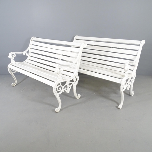 2659 - A pair of white painted slatted garden benches with cast metal ends. 128x82x65cm.