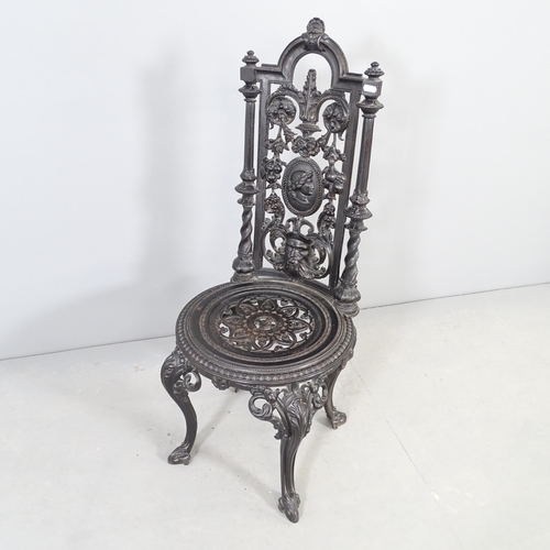 2662 - A painted cast iron garden chair.