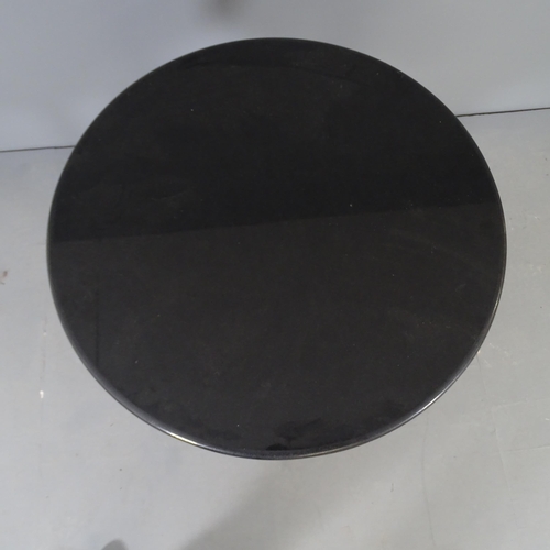 2665 - A circular basalt topped pub table on cast iron base. 75x70cm.