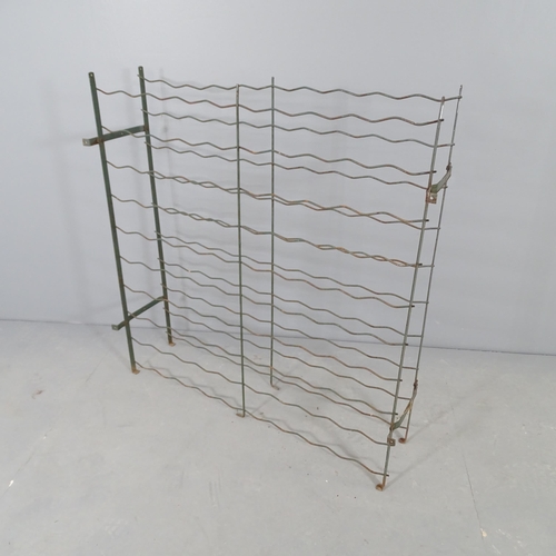 2668 - A French painted metal wine rack. 96x98x26cm.