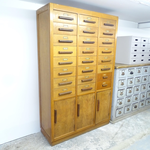 2713 - A French mid-century Notaire cabinet, with 24 drop-front drawers and three cupboards under. 121x191x... 