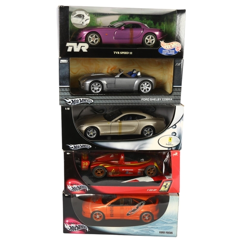 15 - HOT WHEELS - a quantity of 1:18 scale diecast vehicles, complete in original boxes on associated dis... 