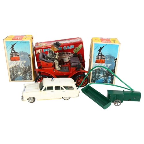 165 - A Vintage Japanese tinplate battery-operated Shakin' Antique car, with driver, unboxed, and 2 simila... 