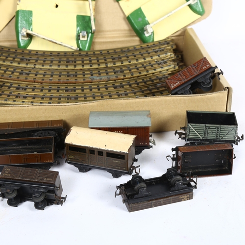 174 - HORNBY DUBLO - a quantity of tinplate 3-rail track, including both straight and curved sections of t... 