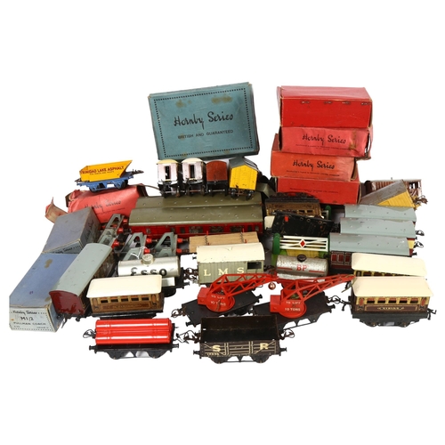 180 - HORNBY SERIES - a quantity of O gauge tinplate carriages, goods wagons, and other associated accesso... 