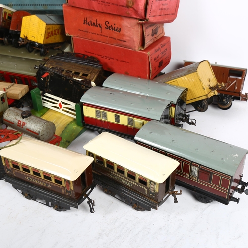 180 - HORNBY SERIES - a quantity of O gauge tinplate carriages, goods wagons, and other associated accesso... 