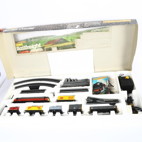 202 - HORNBY - a OO gauge electric train set, Red Star Courier, ref. R759, in original box, and a Hornby R... 