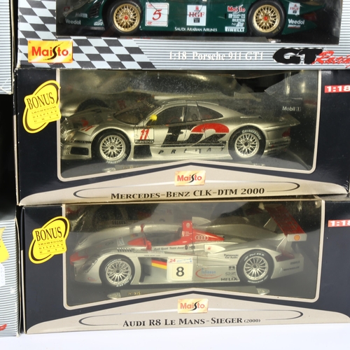 21 - MAISTO GT RACING - a quantity of 1:18 scale diecast models, in original packing with associated disp... 