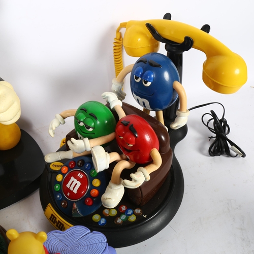 216 - A group of Vintage animated telephones, including a Vintage M and Ms animated telephone, a 1980s Tyc... 