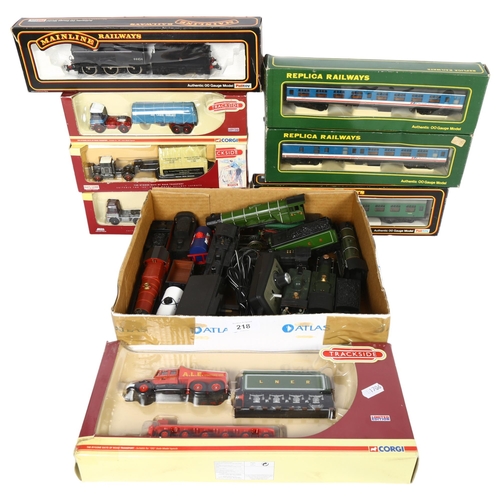 218 - A group of OO gauge locomotives, tenders, and associated goods wagons, some loose and some boxed, in... 