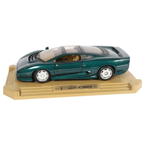 22 - MAISTO - a 1:12 scale diecast model on associated display stand of a Jaguar XJ220, 1992