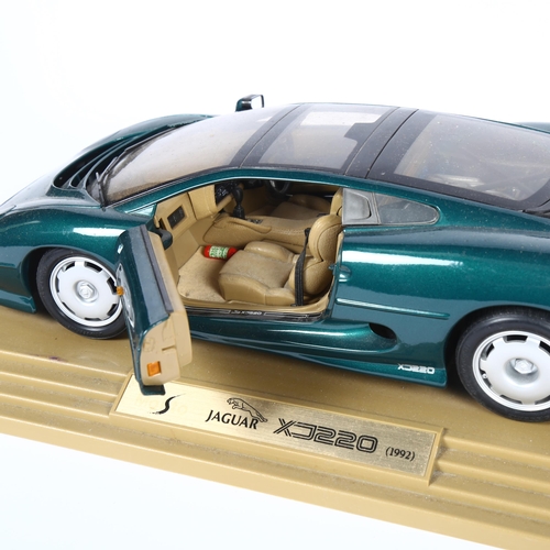 22 - MAISTO - a 1:12 scale diecast model on associated display stand of a Jaguar XJ220, 1992